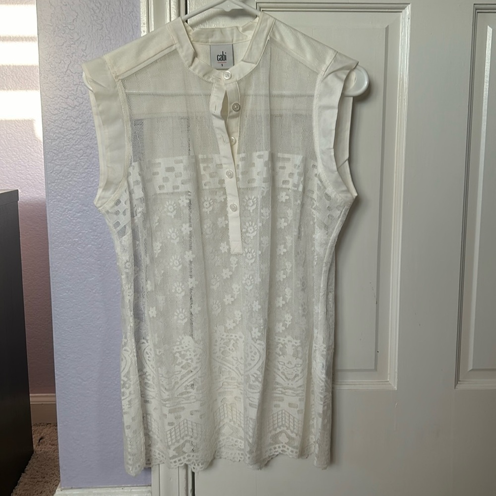 Cabi never worn lace see through top with no sleeves. Round neck with 5 buttons